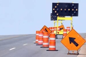 Arrow board trailer with LED directional sign used in road construction zone